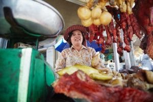 a-happy-vendor-at-russian-market-in-phnom-penh